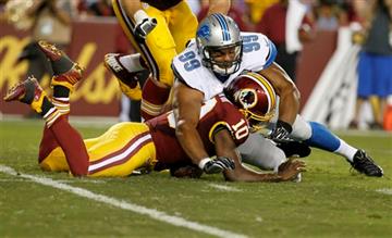 (AP Photo/Alex Brandon). Washington Redskins quarterback Robert Griffin III (10) is hit by Detroit Lions defensive end Corey Wootton (99) while trying to recover a fumble during the first half of an NFL preseason football game, Thursday, Aug. 20, 2015,...