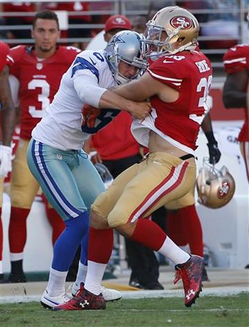 (AP Photo/Tony Avelar). San Francisco 49ers punt returner Jarryd Hayne, right, is tackled by Dallas Cowboys punter Chris Jones during the first half of an NFL preseason football game in Santa Clara, Calif., Sunday, Aug. 23, 2015.