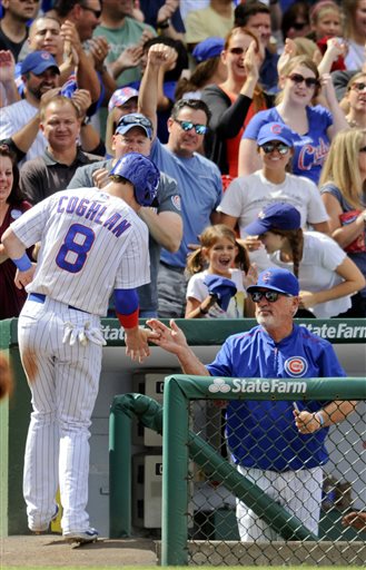 (AP Photo/Matt Marton). Chicago Cubs' Chris Coghlan, left,  gets congratulated by Chicago Cubs manager Joe Maddon, right, after he scored on an Anthony Rizzo RBI triple against the Cleveland Indians during the seventh inning of a baseball game  on Mond...