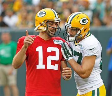 (AP Photo/Mike Roemer, File). FILE - In this Aug. 8, 2015, file photo, Green Bay Packers’ Aaron Rodgers, left, and Jordy Nelson talk during the Green Bay Packers Family Fun Night NFL football training camp practice in Green Bay, Wis. Few receivers are ...