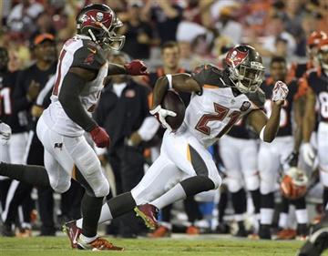 (AP Photo/Phelan M. Ebenhack). Tampa Bay Buccaneers cornerback Alterraun Verner (21) heads for the end zone  after intercepting a pass by Cincinnati Bengals quarterback Andy Dalton during the second quarter of an NFL preseason football game Monday, Aug...