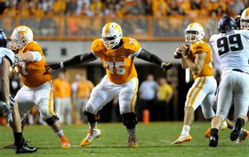 (AP Photo/Knoxville News Sentinel, Michael Patrick, File). FILE - In this Aug. 31, 2014, file photo, Tennessee offensive lineman Marcus Jackson (75) provides pass protection during an NCAA college football game against Utah State in Knoxville, Tenn. Se...