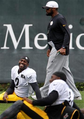 (AP Photo/Keith Srakocic). Pittsburgh Steelers quarterback Michael Vick (2) smiles while stretching and talking with new teammates as head coach Mike Tomlin walks by during practice for the NFL football team, Wednesday, Aug. 26, 2015 in Pittsburgh. The...