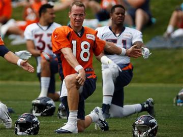 (AP Photo/David Zalubowski). Denver Broncos quarterback Peyton Manning stretches before facing the San Francisco 49ers in an NFL football scrimmage at the Broncos' headquarters Thursday, Aug. 27, 2015, in Englewood, Colo.