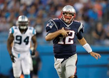 (AP Photo/Bob Leverone). New England Patriots' Tom Brady (12) scrambles as Carolina Panthers' Kony Ealy (94) pursues during the first half of a preseason NFL football game in Charlotte, N.C., Friday, Aug. 28, 2015.