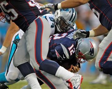 (AP Photo/Mike McCarn). New England Patriots' Tom Brady (12) is sacked by Carolina Panthers' Kony Ealy (94) during the first half of an NFLpreseason football game in Charlotte, N.C., Friday, Aug. 28, 2015.