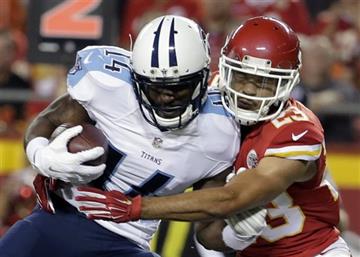 (AP Photo/Charlie Riedel). Tennessee Titans wide receiver Hakeem Nicks (14) is tackled by Kansas City Chiefs defensive back Phillip Gaines (23) during the first half of a preseason NFL football game at Arrowhead Stadium in Kansas City, Mo., Friday, Aug...