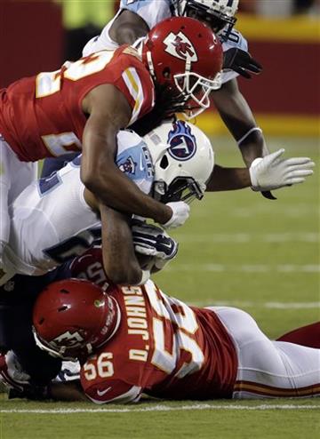 (AP Photo/Charlie Riedel). Tennessee Titans running back Dexter McCluster (22) is tackled by Kansas City Chiefs linebacker Derrick Johnson (56) and defensive back Marcus Peters, top, during the first half of a preseason NFL football game at Arrowhead S...
