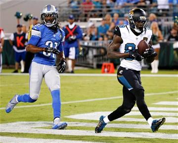 (AP Photo/Stephen B. Morton). Jacksonville Jaguars wide receiver Allen Hurns, right, catches a pass for a 13-yard touchdown in front of Detroit Lions cornerback Rashean Mathis during the first half of an NFL preseason football game in Jacksonville, Fla...