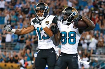 (AP Photo/Stephen B. Morton). Jacksonville Jaguars wide receiver Allen Hurns (88) celebrates his 13-yard touchdown catch with wide receiver Rashad Greene (13) during the first half of an NFL preseason football game against the Detroit Lions in Jacksonv...
