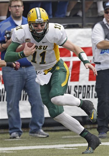 (AP Photo/Rick Bowmer). North Dakota State quarterback Carson Wentz (11) runs for a touchdown during the first half of an NCAA college football game against Montana Saturday, Aug. 29, 2015, in Missoula, Mont.