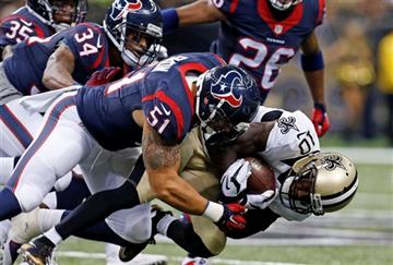 (AP Photo/Jonathan Bachman). New Orleans Saints wide receiver Brandin Cooks (10) is tackled by Houston Texans linebacker John Simon (51) in the first half of a preseason NFL football game in New Orleans, Sunday, Aug. 30, 2015.