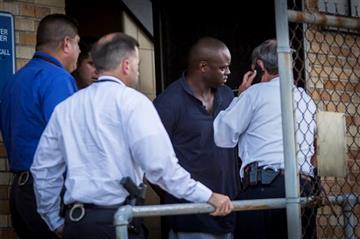 (Marie D. De Jesus/Houston Chronicle via AP). Shannon J. Miles, 30, is walked out of the Harris County Sheriff's Department in Houston on Saturday, Aug. 29, 2015. Prosecutors on Saturday charged Miles with capital murder in the killing of a uniformed s...