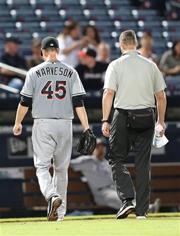 (AP Photo/John Bazemore). Miami Marlins starting pitcher Chris Narveson (45) walks off the field with a member of the Miami training staff in the sixth inning of a baseball game against the Atlanta Braves Monday, Aug. 31, 2015, in Atlanta.