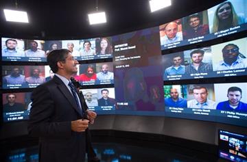 (AP Photo/Gretchen Ertl). Harvard Business School Professor and faculty chair of HBX Bharat Anand demonstrates HBX Live, an online classroom that allows real-time interaction between professors and students from around the world, at the WGBH television...