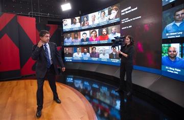 (AP Photo/Gretchen Ertl). Harvard Business School Professor and faculty chair of HBX Bharat Anand demonstrates HBX Live, an online classroom that allows real-time interaction between professors and students from around the world, at the WGBH television...