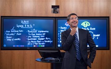 (AP Photo/Gretchen Ertl). Harvard Business School Professor and faculty chair of HBX Bharat Anand demonstrates HBX Live, an online classroom that allows real-time interaction between professors and students from around the world, at the WGBH television...