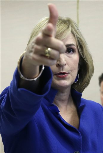 (AP Photo/Pat Sullivan). Harris County District Attorney Devon Anderson explains outside state district court, on Monday, Aug. 31, 2015, in Houston, how Sheriff's Deputy Darren Goforth was gunned down. Shannon Miles has been charged with capital murder...