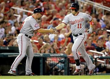 (AP Photo/Jeff Roberson). Washington Nationals' Ryan Zimmerman, right, is congratulated by third base coach Bob Henley while rounding the bases after hitting a solo home run during the third inning of a baseball game against the St. Louis Cardinals Tue...