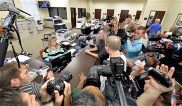 (AP Photo/Timothy D. Easley). Surrounded by the media, David Moore, center, and his partner David Ermold attempt to apply for a marriage license at the Rowan County Courthouse in Morehead, Ky., Tuesday, Sept. 1, 2015. Although her appeal to the US Supr...