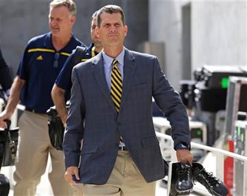 (AP Photo/Rick Bowmer). Michigan coach Jim Harbaugh arrives for his team's NCAA college football game against Utah on Thursday, Sept. 3, 2015, in Salt Lake City.