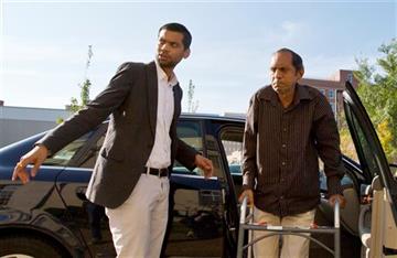 (AP Photo/Brynn Anderson). Chirag Patel helps his father, Sureshbhai Patel, out of the car as they arrive outside the federal courthouse before start of a trial against Madison, Ala., police Officer Eric Sloan Parker, Tuesday, Sept. 1, 2015, in Huntsvi...