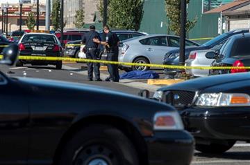 (KCRA3, KXTV10, KOVR13, KUVS19, KMAZ31, KTXL40). Police officers stand near the body of a victim killed in a shooting at Sacramento City College, Thursday, Sept. 3, 2015, in Sacramento, Calif. The shooting occurred in a parking lot near the baseball fi...