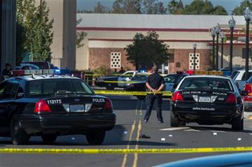 (KCRA3, KXTV10, KOVR13, KUVS19, KMAZ31, KTXL40). A police officer stands guard as Sacramento City College is on lockdown while police search the area after a shooting, Thursday, Sept. 3, 2015, in Sacramento, Calif. The shooting occurred in a parking lo...