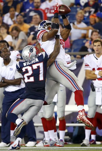 (AP Photo/Winslow Townson). New York Giants tight end Jerome Cunningham, rear, catches a pass over New England Patriots strong safety Tavon Wilson (27) in the second half of an NFL football game Thursday, Sept. 3, 2015, in Foxborough, Mass.