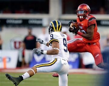 (AP Photo/Rick Bowmer). Utah defensive back Marcus Williams (20) catches an interception against Michigan wide receiver Grant Perry (9) in the second quarter during an NCAA college football game, Thursday, Sept. 3, 2015, in Salt Lake City.