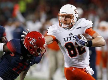 (AP Photo/Rick Scuteri). UTSA tight end David Morgan II (82) stiff arms Arizona safety Will Parks during the first half of an NCAA college football game, Thursday, Sept. 3, 2015, in Tucson, Ariz.