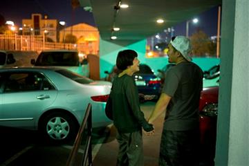 (AP Photo/Jae C. Hong). In this Wednesday, Aug. 5, 2015 photo, Inhui Bak, left, laughs while chatting  with her son, Daniel, a 22-year-old recovering drug addict, at Nanoom Christian Fellowship, a drug rehab for Korean Americans, in Los Angeles. “I kne...
