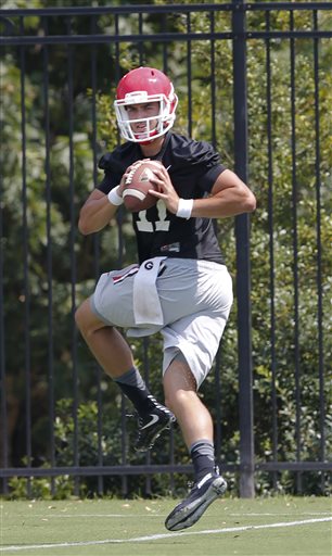 (AP Photo/John Bazemore, File). FILE - In this Aug. 4, 2015, file photol Georgia quarterback Greyson Lambert throws during a college football practice in Athens, Ga. Lambert's graduate transfer from Virginia to Georgia didn't draw many headlines, but i...