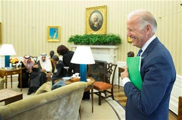 (AP Photo/Evan Vucci). Vice President Joe Biden, right, stands in the Oval Office of the White House during a meeting between President Barack Obama and King Salman of Saudi Arabia, on Friday, Sept. 4, 2015, in Washington.