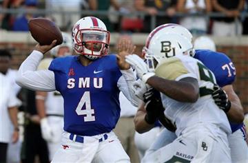 (AP Photo/LM Otero). SMU quarterback Matt Davis (4) passes as offensive lineman Kris Weeks (75) blocks Baylor defensive end Jamal Palmer (92) during the first half of an NCAA college football game Friday, Sept. 4, 2015, in Dallas.