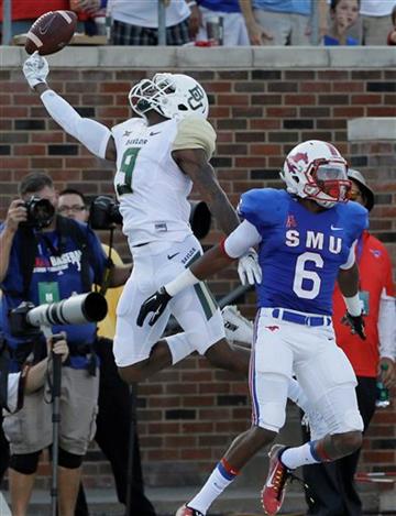 (AP Photo/LM Otero). Baylor wide receiver KD Cannon (9) reaches for a pass against SMU defensive back Jesse Montgomery (6) during the first half of an NCAA college football game Friday, Sept. 4, 2015, in Dallas.