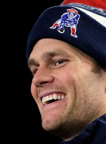 (AP Photo/Charles Krupa, File). FILE - In this Jan. 6, 2015, file photo, New England Patriots quarterback Tom Brady smiles during a news conference after an NFL football practice in Foxborough, Mass. A federal judge deflated "Deflategate" Thursday, Sep...