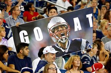 (AP Photo/Winslow Townson). Fans hold a photo of New England Patriots quarterback Tom Brady in the first half of an NFL football game Thursday, Sept. 3, 2015, in Foxborough, Mass. Federal Judge Richard M. Berman overturned NFL Commissioner Roger Goodel...
