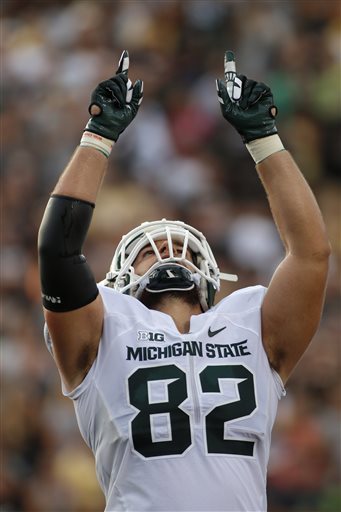(AP Photo/Al Goldis). Michigan State tight end Josiah Price celebrates his touchdown reception against Western Michigan during the first quarter of an NCAA college football game, Friday, Sept. 4, 2015, in Kalamazoo, Mich.