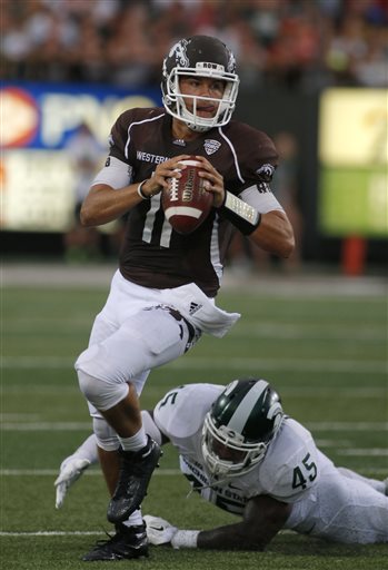 (AP Photo/Al Goldis). Western Michigan quarterback Zach Terrell escapes from a tackle attempt by Michigan State's Darien Harris (45) during the second quarter of an NCAA college football game, Friday, Sept. 4, 2015, in Kalamazoo, Mich.