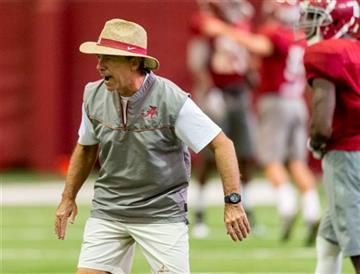 (Vasha Hunt/AL.com via AP). Alabama coach Nick Saban works with his players during NCAA college football practice, Wednesday, Sept. 2, 2015, in Tuscaloosa, Ala.