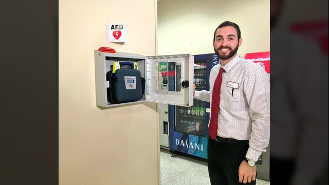 (WJAX) - Joseph Micacchione is being hailed as a hero after he used an AED machine on a passenger who passed out while Micacchione was working at the Avis/Budget counter at Jacksonville International Airport.